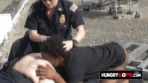 Horny female cops are teaching a black suspect a hardcore lesson.