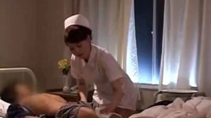 Oriental nurse puts her hands to work on a patients
