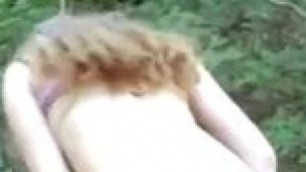 amateur Redhead slut shows her pussy in the woods