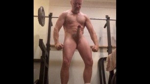 Big muscle stud in see through underwear, white socks and trainers flexes and cums