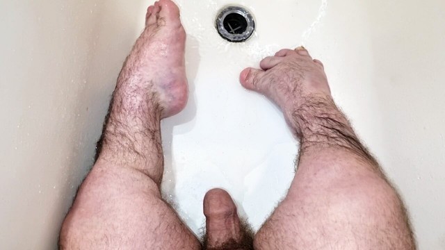 Midget shows his feet and then cums on them