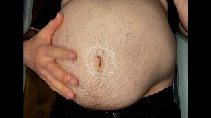 rubbing oil around big ball belly